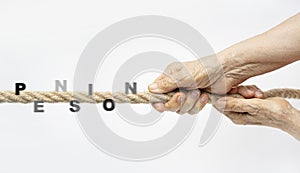 Senior struggling in retirement concept. Aged wrinkled hands pull the rope with text Pension