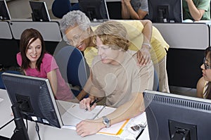 Senior Teacher Assisting Students photo