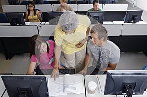 Senior Teacher Assisting Students