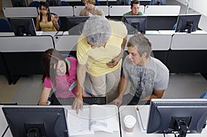 Senior Teacher Assisting Students