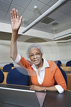 Senior Teacher Raising Hand