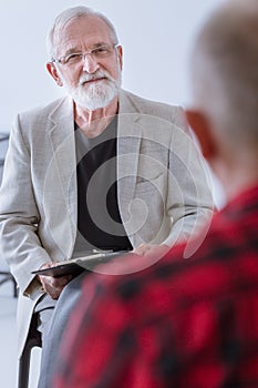 Senior therapist with problematic patient during counseling