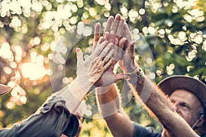 Senior trekkers giving a high five photo