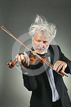 Senior violinist with upset white hairs