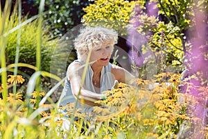 Senior woman with an active lifestyle enjoying retirement with garden work