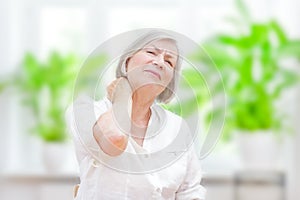 Senior woman acute neck pain