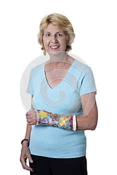 Senior woman with arm in painted cast