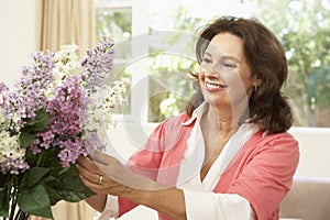 Senior Woman Arranging Flowers