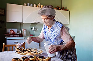 Senior woman baking