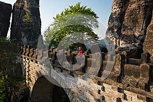 Senior woman on Bastei bridge in Saxon Switzerland, Germany