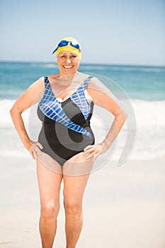 Senior woman with bathing cap at the beach