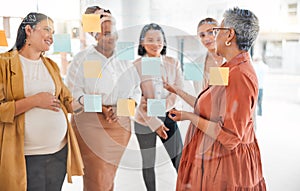 Senior woman in a business meeting for marketing strategy, advertising plan or branding ideas. Sticky notes, leadership