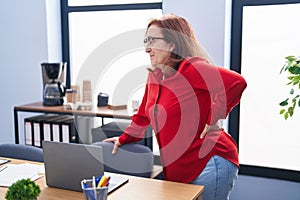 Senior woman business worker suffering for backache at office