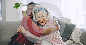 Senior woman, caregiver and hug with love on sofa or happiness on face in nursing home, house or living room with