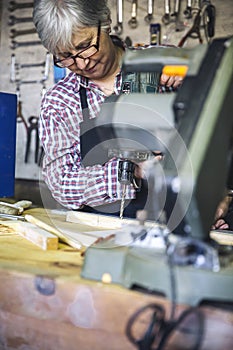 Senior woman in a carpentry