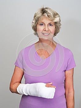Senior woman with cast on arm