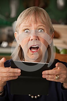 Senior woman with checkbook photo