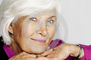 Senior woman chin on hands