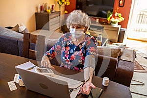 Senior woman consulting with a doctor on her laptop