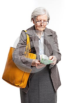 Senior woman counting money