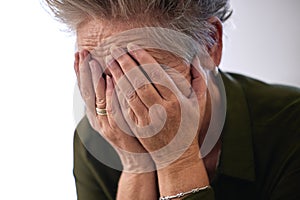 Senior woman, cover face with hands and sad for diagnosis, mental health and shocking news. Mature female, elderly lady
