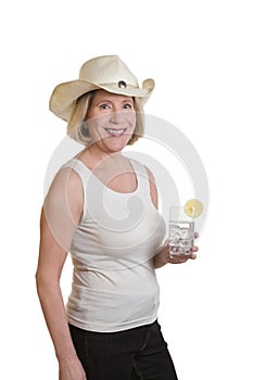 Senior woman with cowboyhat and drink