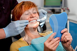 Senior woman in the dental office.