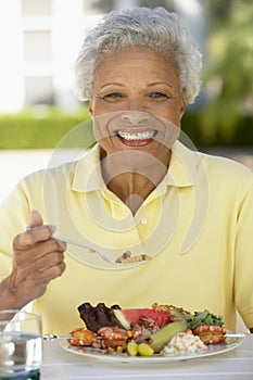 Senior Woman Dining Al Fresco