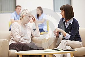 Senior Woman Discussing Test Results With Doctor
