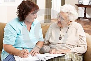 Senior Woman In Discussion With Health Visitor