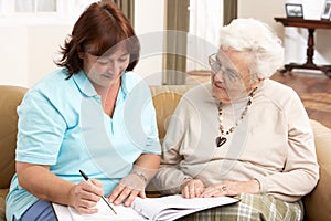 Senior Woman In Discussion With Health Visitor photo