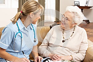 Senior Woman In Discussion With Health Visitor photo