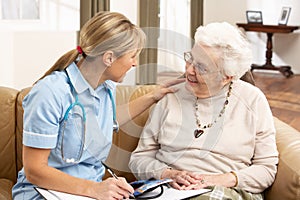 Senior Woman In Discussion With Health Visitor photo