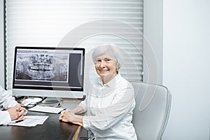 Senior woman with doctor in the office