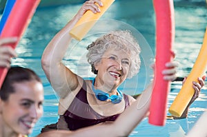 Senior woman doing aqua aerobic