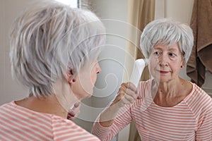 Senior woman doing deep pore cleaning