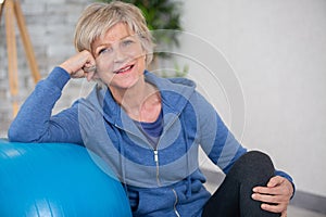 senior woman doing exercise with pillates ball