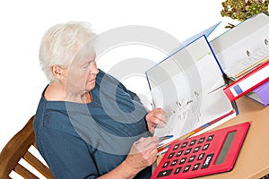 Senior woman doing her accounts