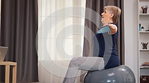 Senior woman doing sport in her apartment