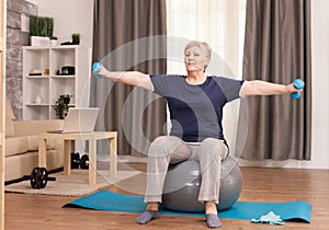 Senior woman doing warm up exercise