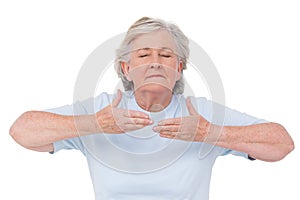 Senior woman doing yoga exercise