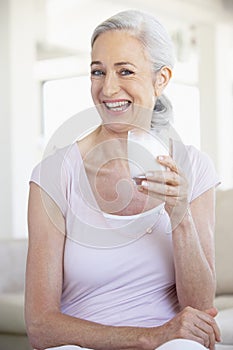 Senior Woman Drinking A Glass Of Milk