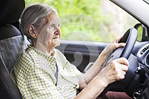 Senior woman driving a car.