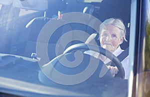 Senior woman driving car