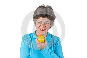 Senior woman eating apple