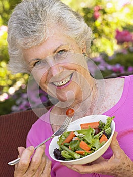 Senior Woman Eating Fresh Salad