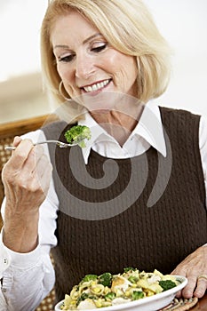 Senior Woman Eating A Healthy Meal