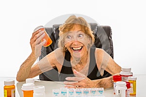 Senior Woman Ecstatic About Pills To Refill Her Weekly Pill Box