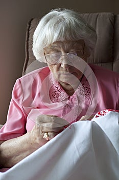 Senior woman embroidering