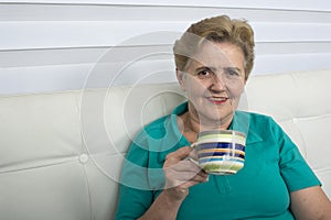 Senior Woman Enjoying Cup Of Tea.